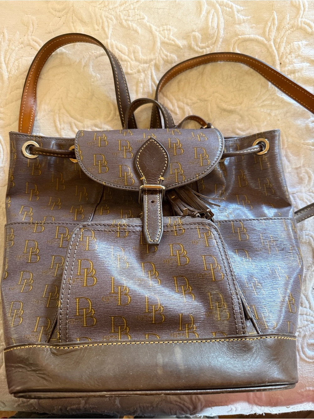 Authentic Dooney and Bourke Monogram Brown Logo Drawstring leatherBackpack